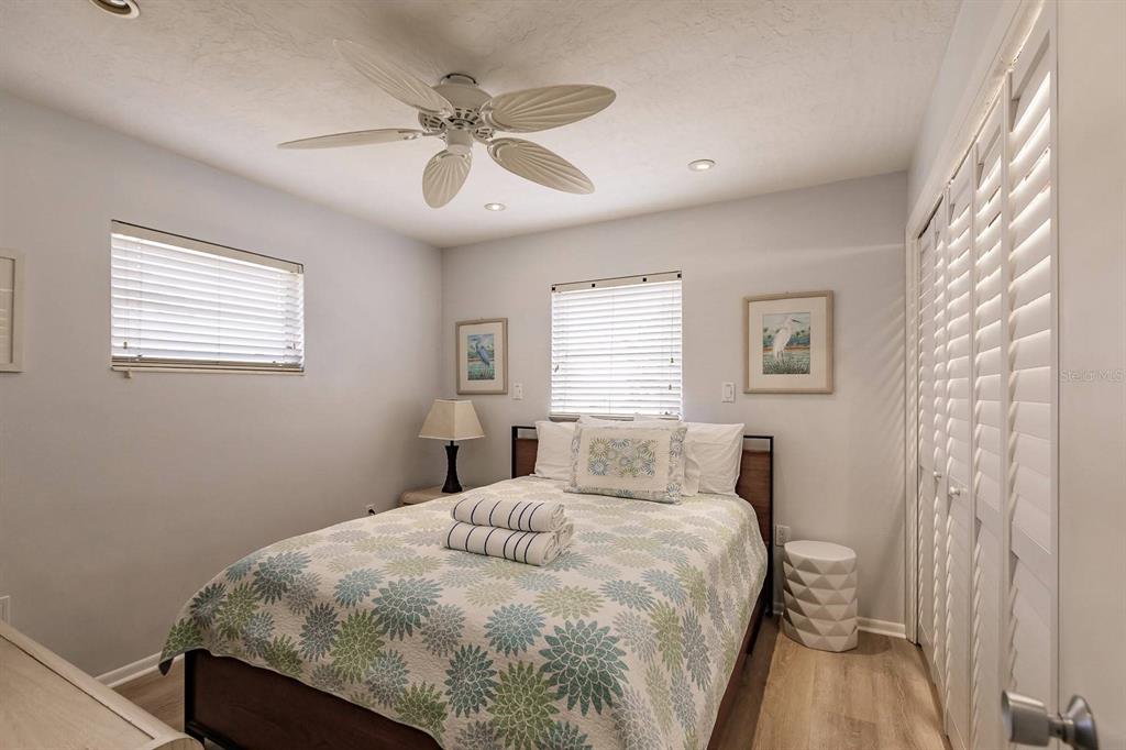 6020 Midnight Pass Road, Unit 59 Sarasota, FL 34242 - Photo 6 of 12 a bedroom with a bed and a window