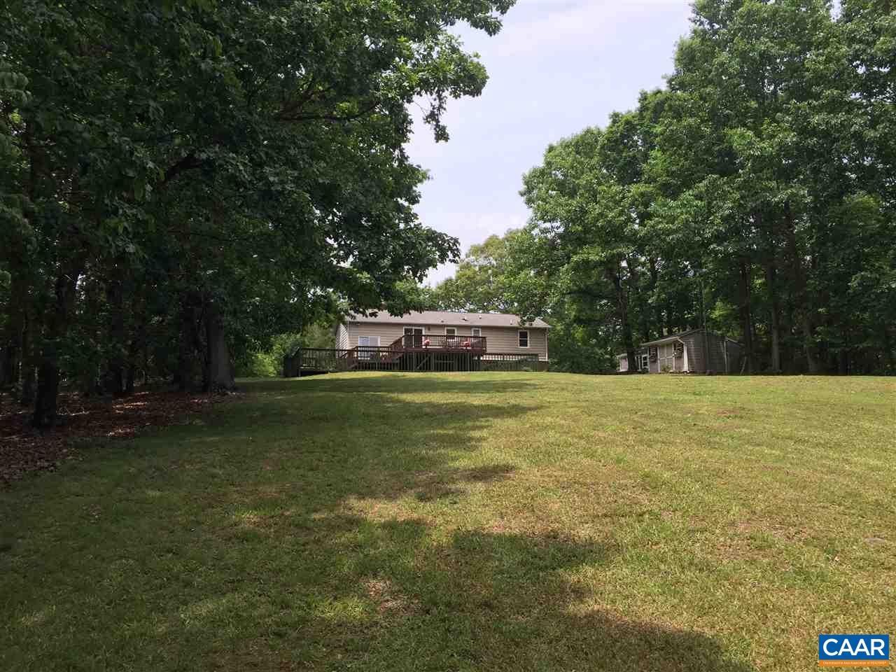 340 Gold Mine Road Palmyra, VA 22963 - Photo 17 of 38 a swimming pool with trees in the background