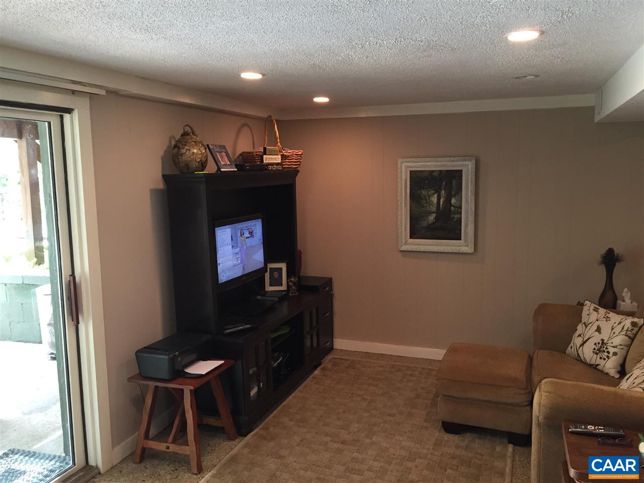340 Gold Mine Road Palmyra, VA 22963 - Photo 34 of 38 a living room with furniture a piano and a flat screen tv
