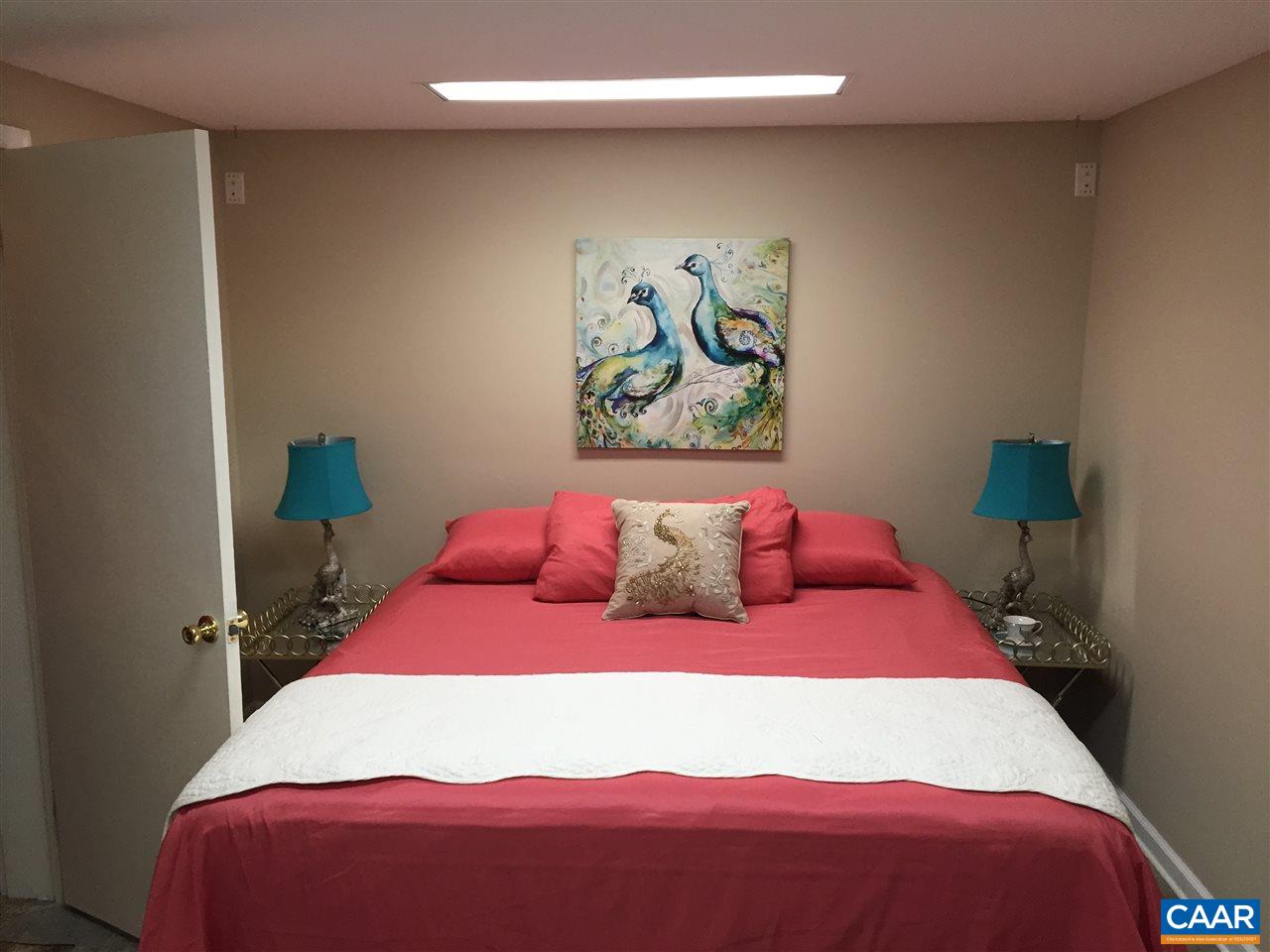 340 Gold Mine Road Palmyra, VA 22963 - Photo 37 of 38 a bedroom with a bed and a painting on the wall