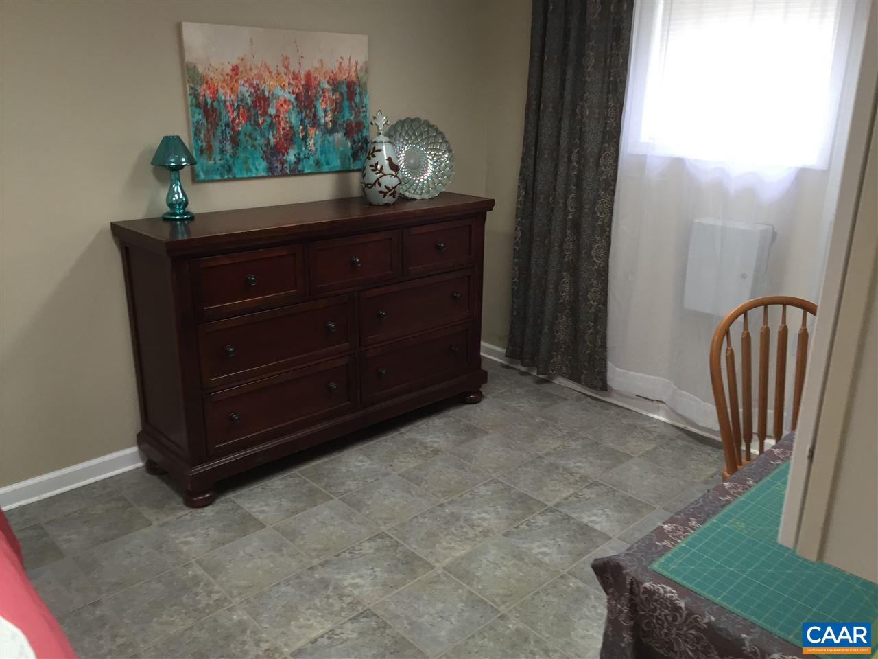 340 Gold Mine Road Palmyra, VA 22963 - Photo 38 of 38 a room with a bed and a mirror