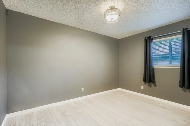 a view of a room with a bed