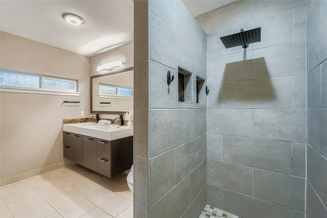 a utility room with cabinets and washer