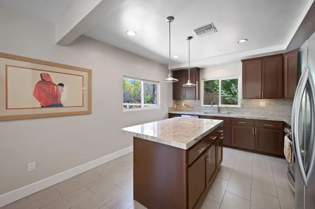 a spacious bedroom with a bed and window