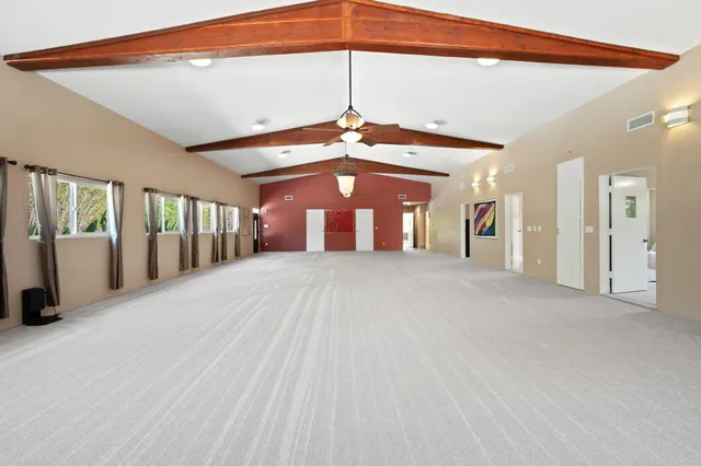 a view of a park with swings and slides