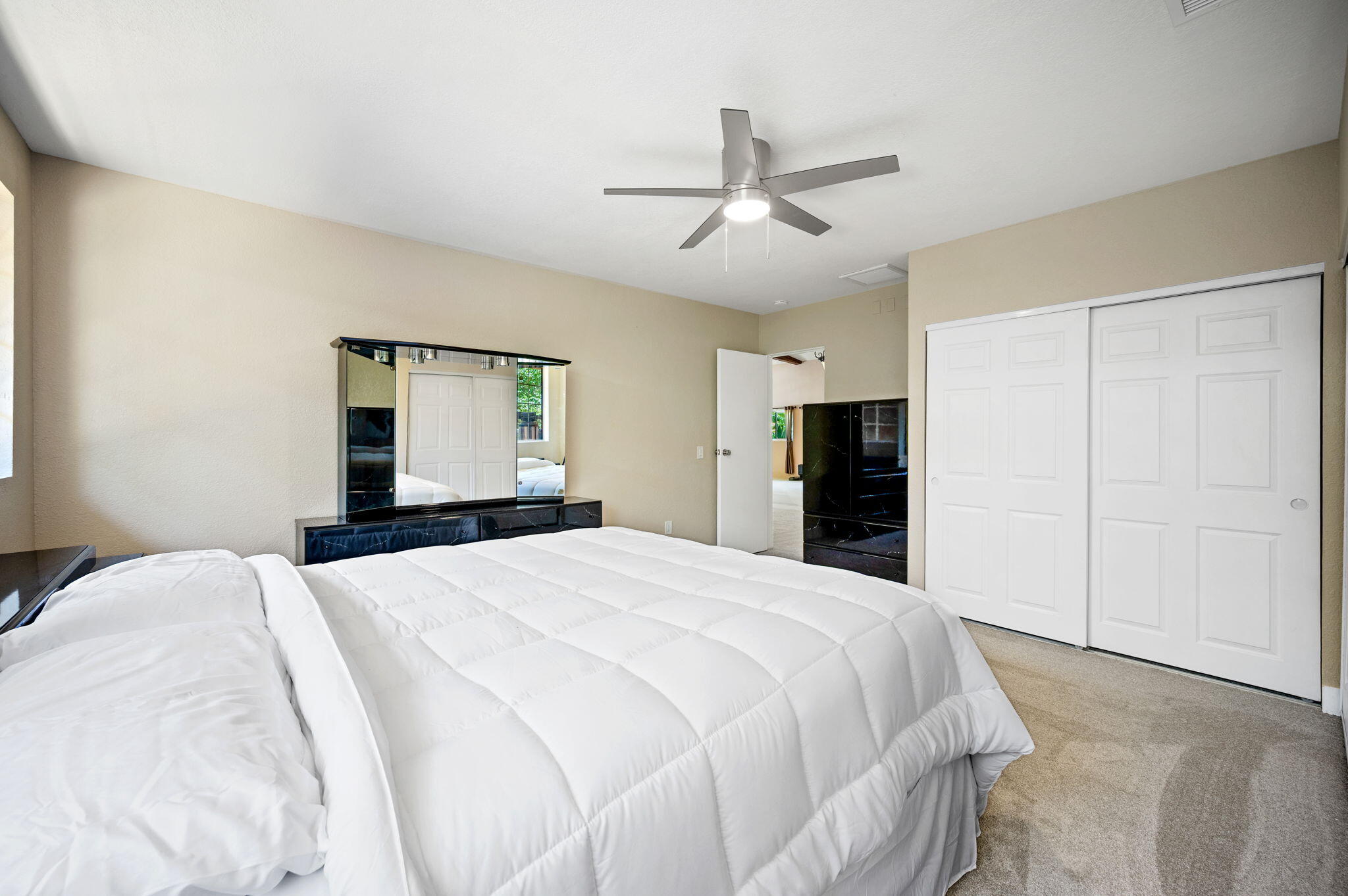 5905 Old Wheeler Road La Verne, CA 91750 - Photo 40 of 81 a bedroom with a large bed and a chandelier