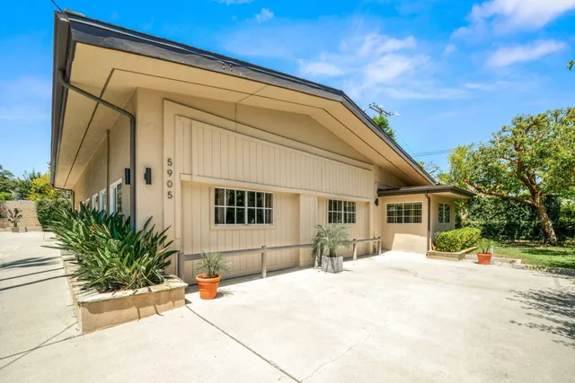 a front view of a house with a patio