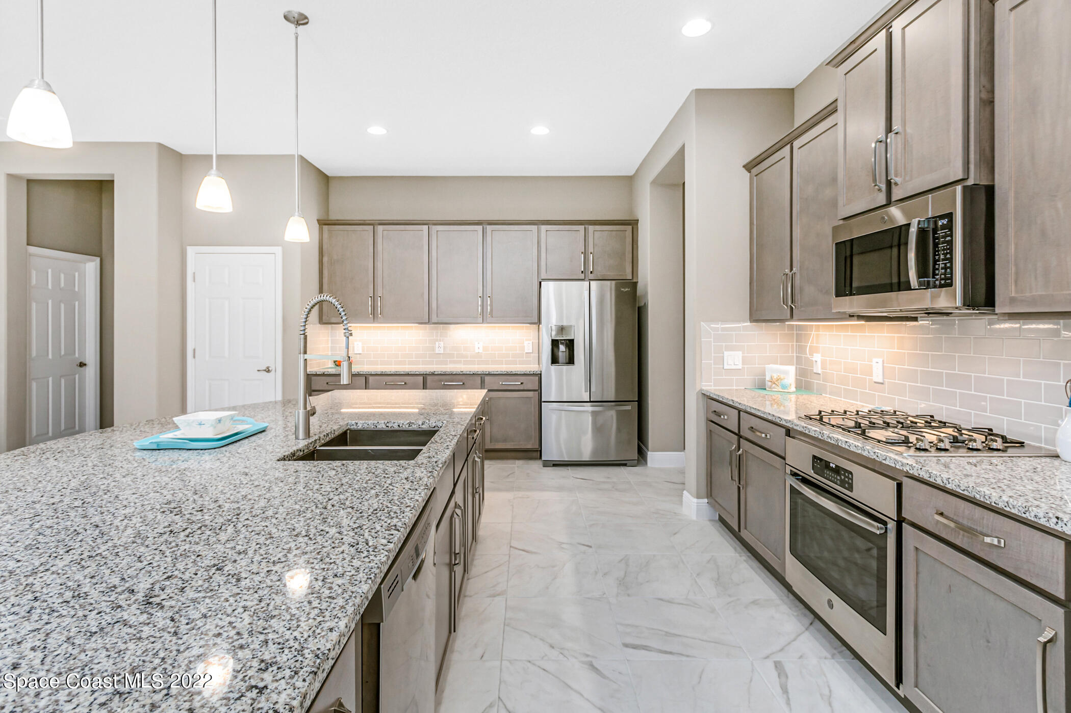 4392 Ruthann Circle Melbourne, FL 32934 - Photo 9 of 36 So much cabinet and counter space!