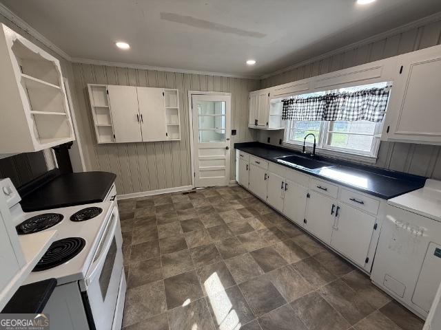 451 Lambs Bridge Road Swainsboro, GA 30401 - Photo 8 of 23 a kitchen with stainless steel appliances a stove a sink and a refrigerator