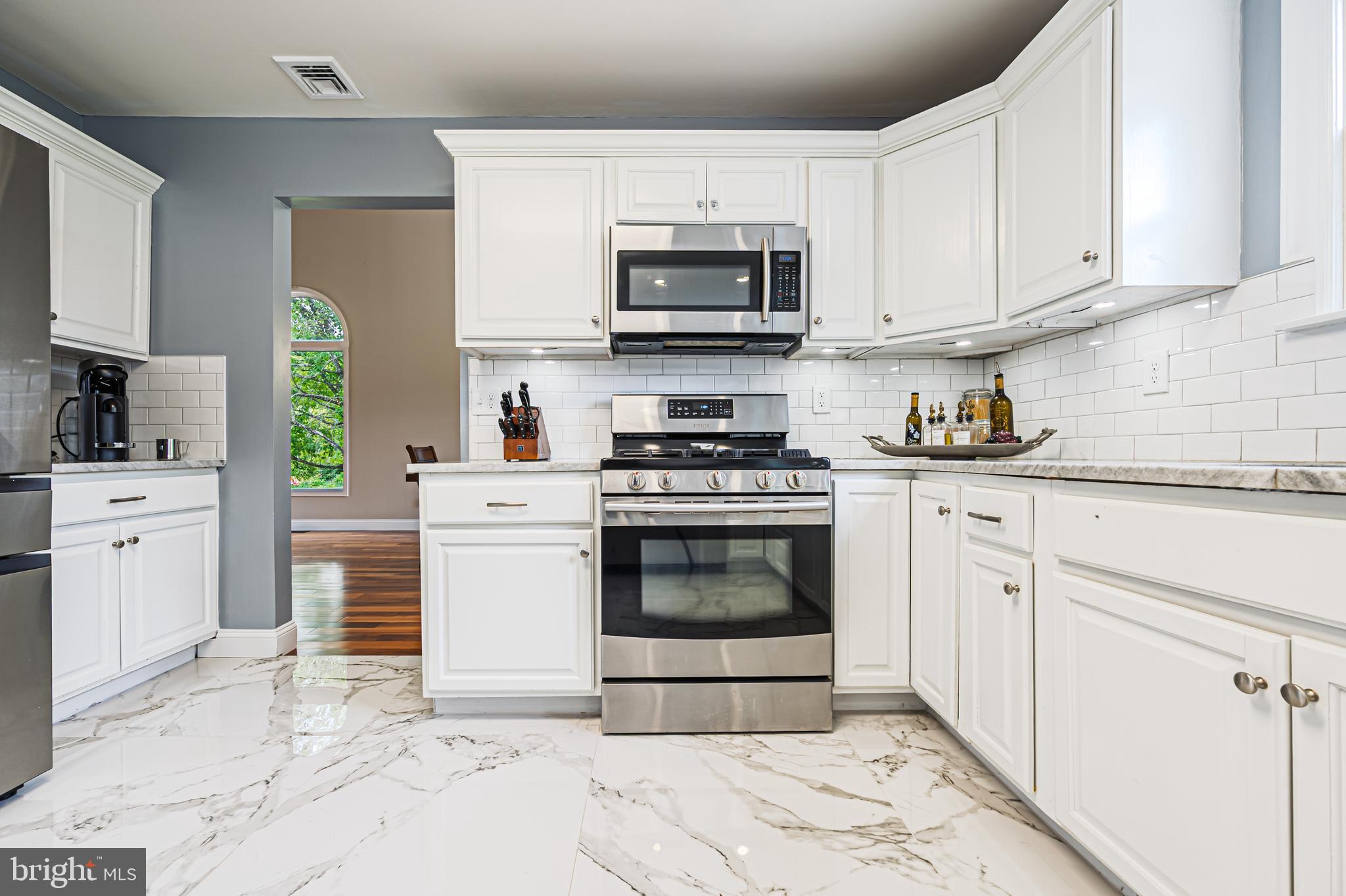 900 Elwood Road, Unit MULLICA Hammonton, NJ 08037 - Photo 16 of 56 a kitchen with white cabinets and appliances