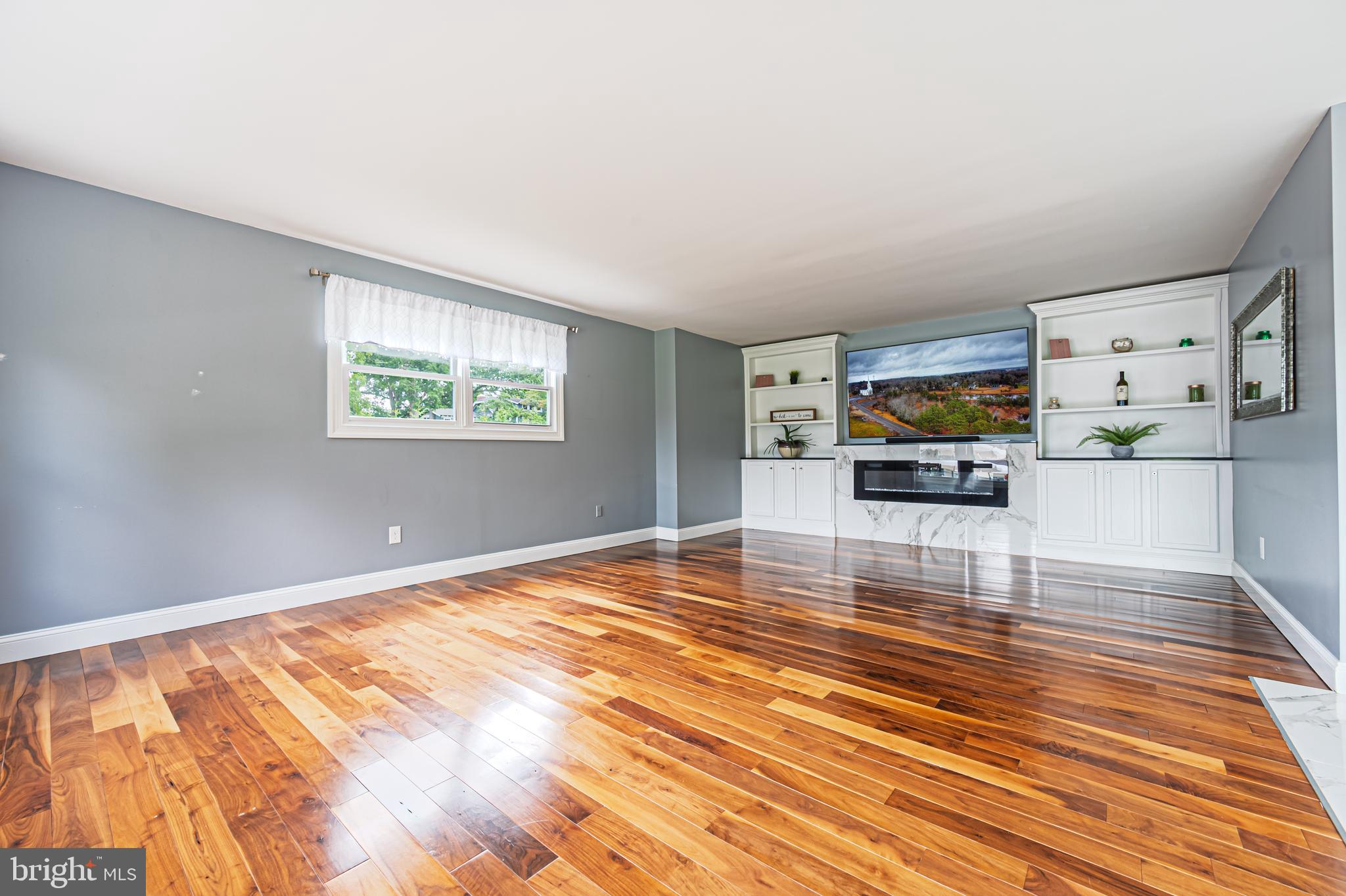 900 Elwood Road, Unit MULLICA Hammonton, NJ 08037 - Photo 19 of 56 a living room with furniture and a flat screen tv