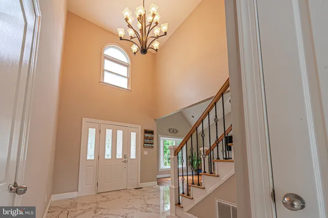 a bedroom with a bed lamps and window
