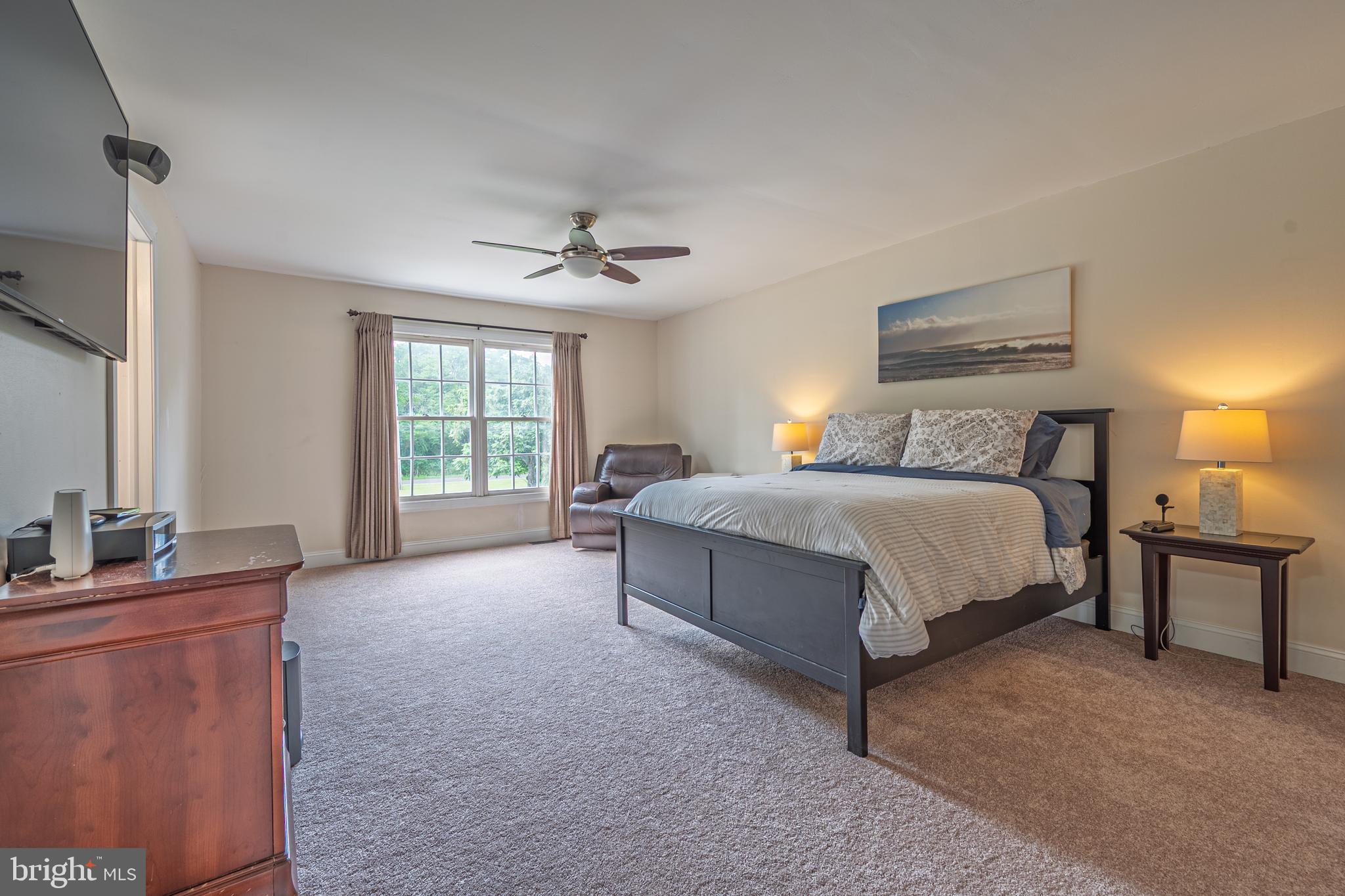 900 Elwood Road, Unit MULLICA Hammonton, NJ 08037 - Photo 22 of 56 a bedroom with a bed lamps and window