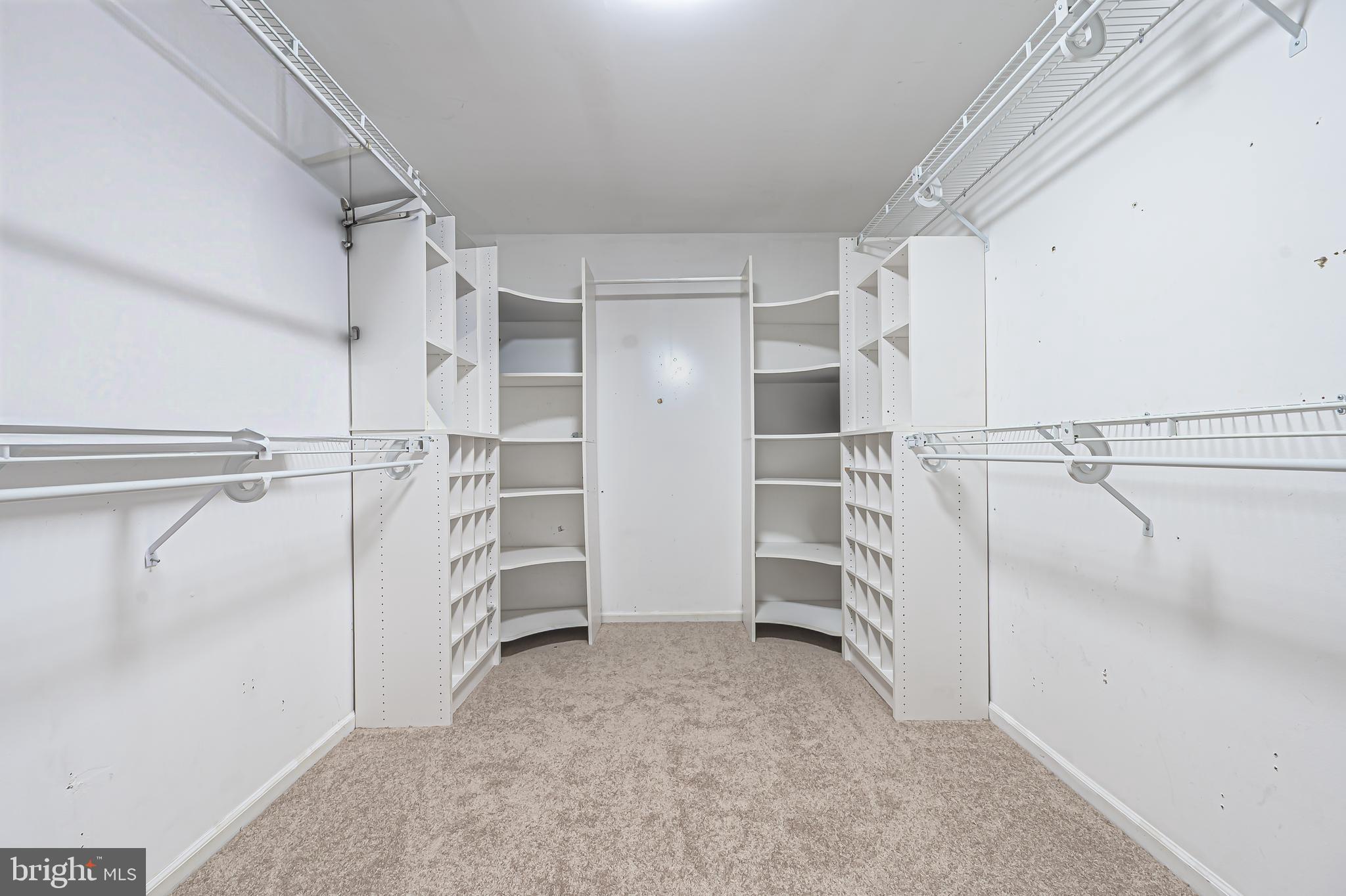 900 Elwood Road, Unit MULLICA Hammonton, NJ 08037 - Photo 25 of 56 a view of walk in closet with empty racks