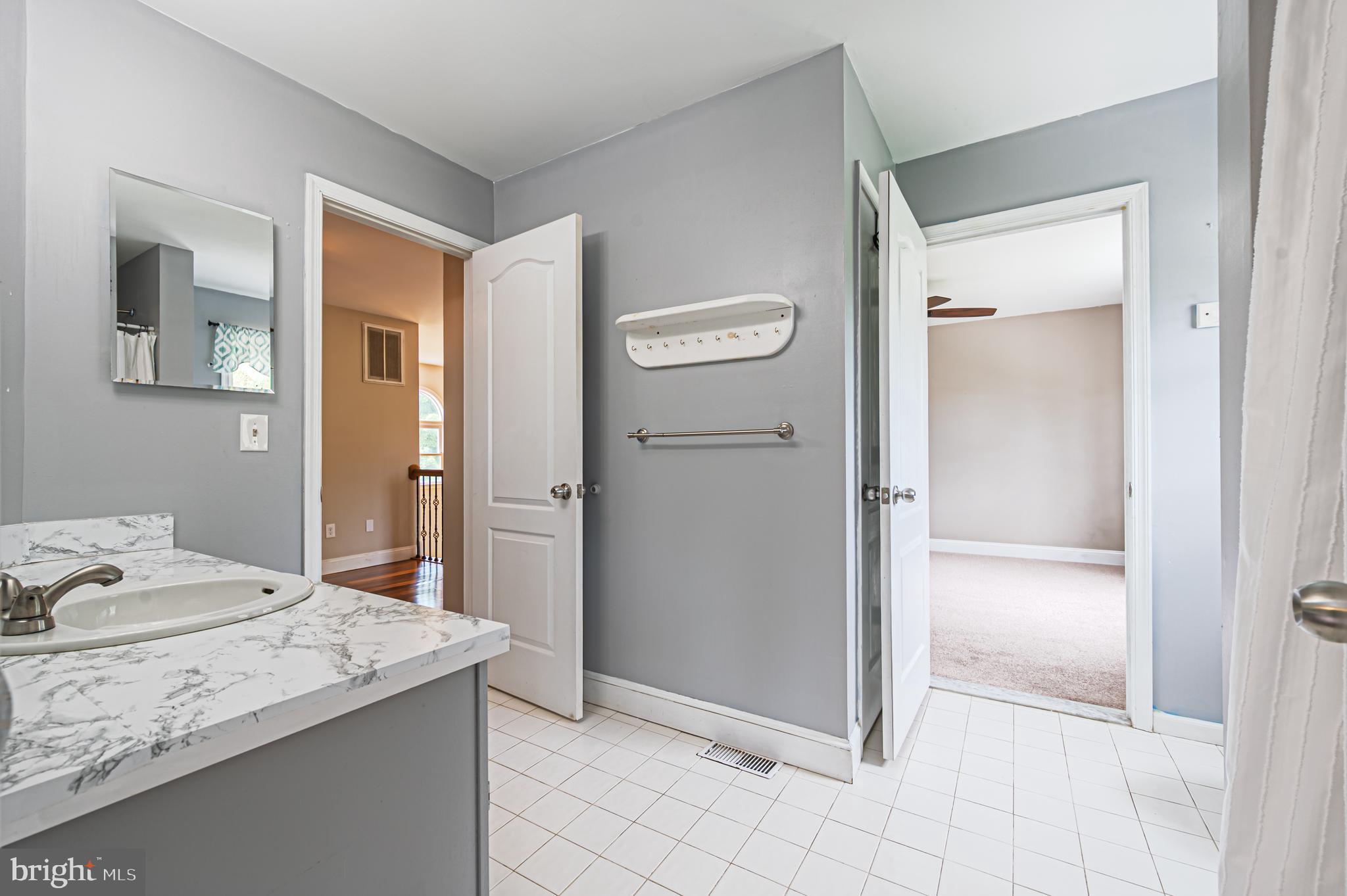 900 Elwood Road, Unit MULLICA Hammonton, NJ 08037 - Photo 28 of 56 a bathroom with a granite countertop sink and a mirror