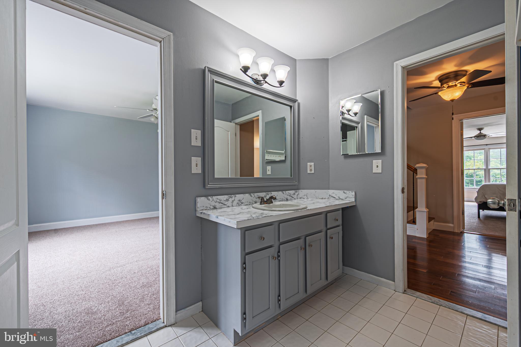 900 Elwood Road, Unit MULLICA Hammonton, NJ 08037 - Photo 29 of 56 a bathroom with a sink a mirror and a shower