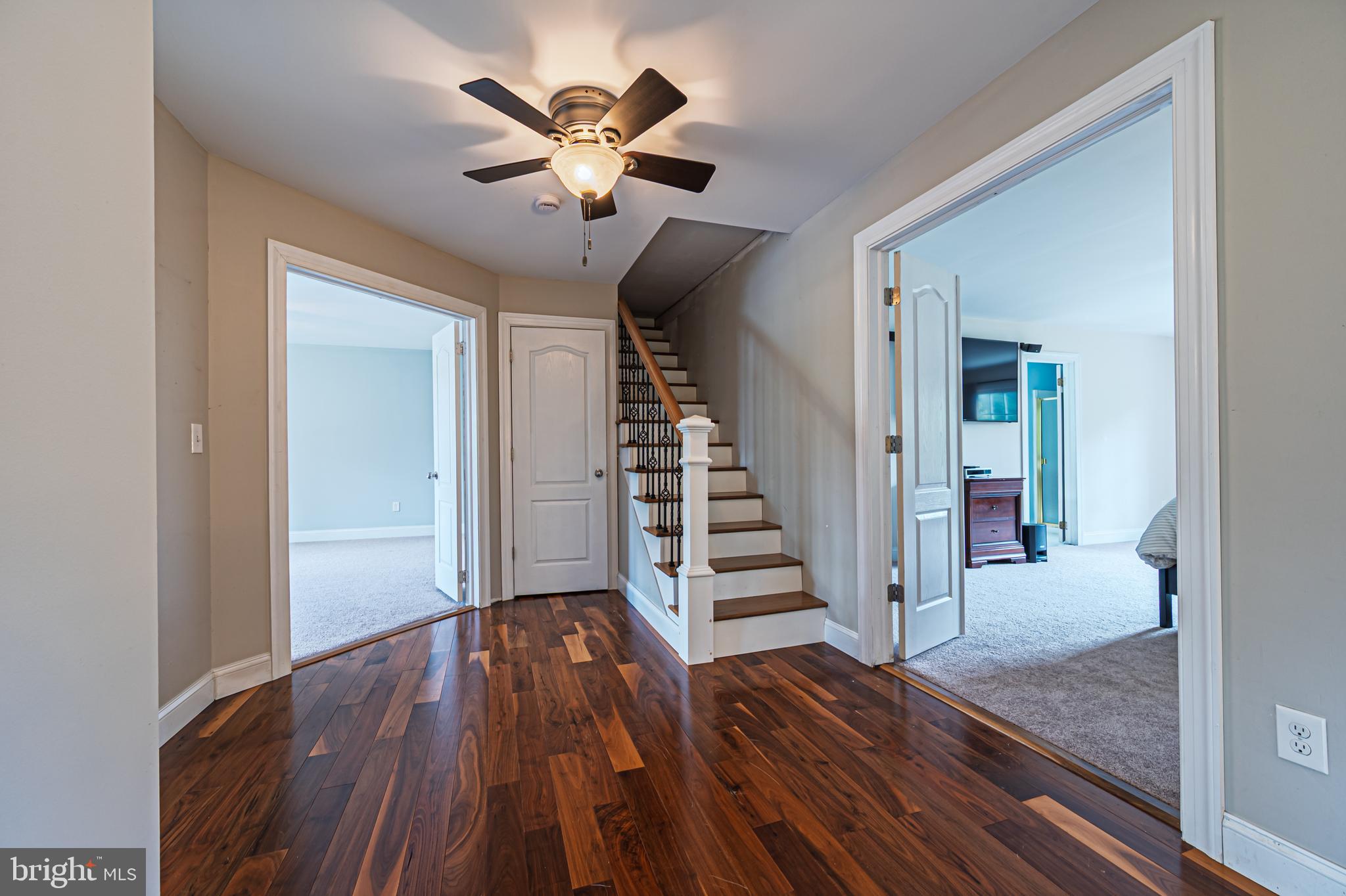 900 Elwood Road, Unit MULLICA Hammonton, NJ 08037 - Photo 31 of 56 a view of a hallway with wooden floor and staircase