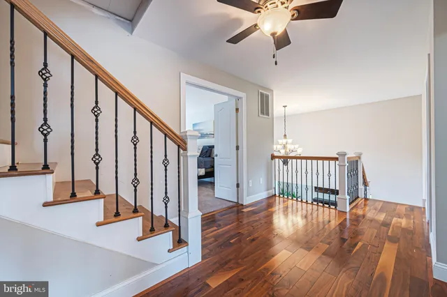 a view of a house with backyard and a tree