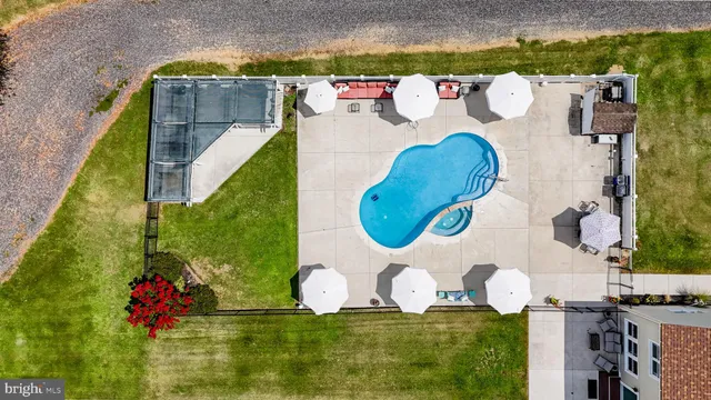 a front view of house with outdoor space and swimming pool