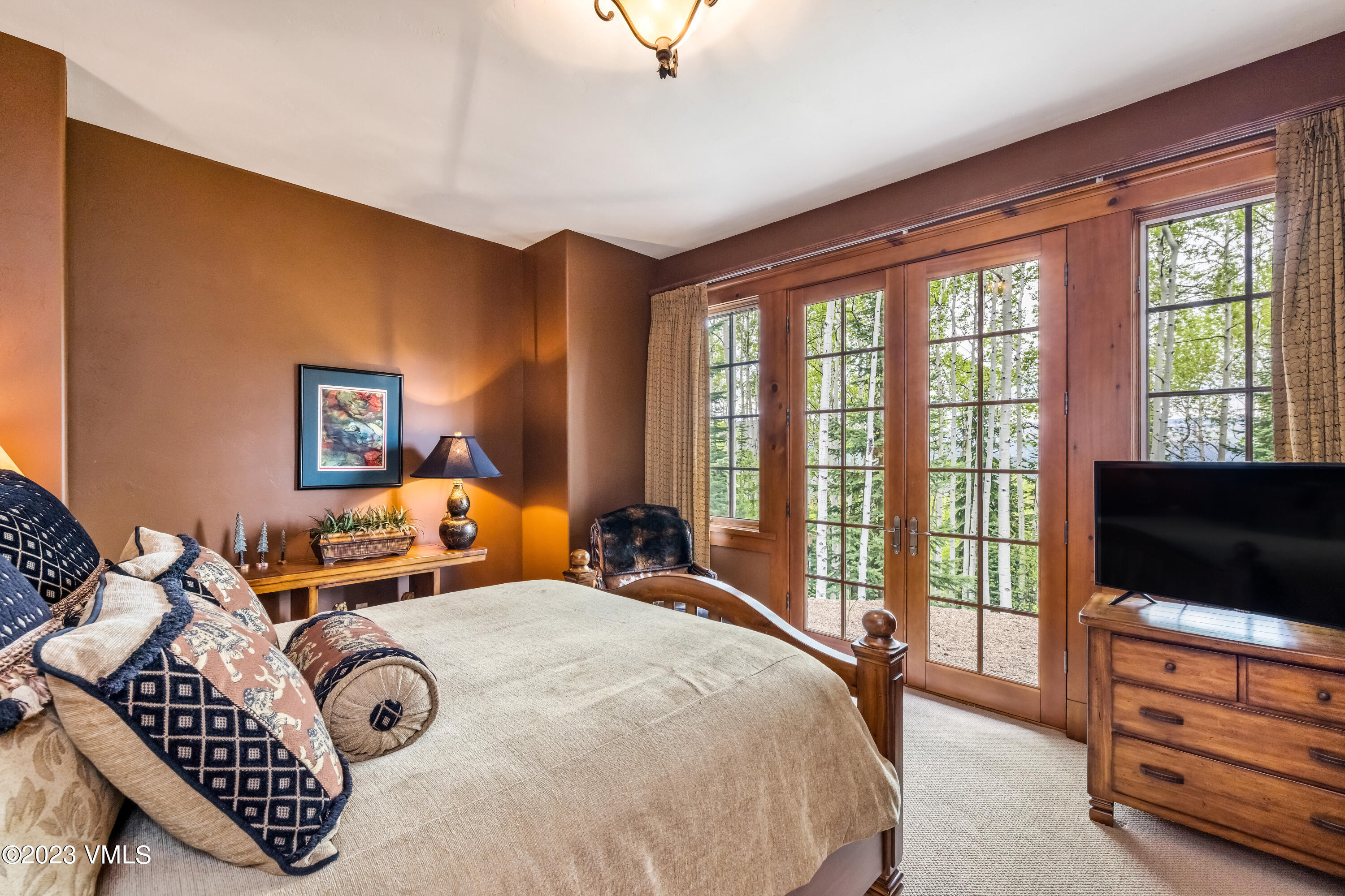 181 Summit Trail Edwards, CO 81632 - Photo 27 of 40 a bedroom with furniture and a flat screen tv