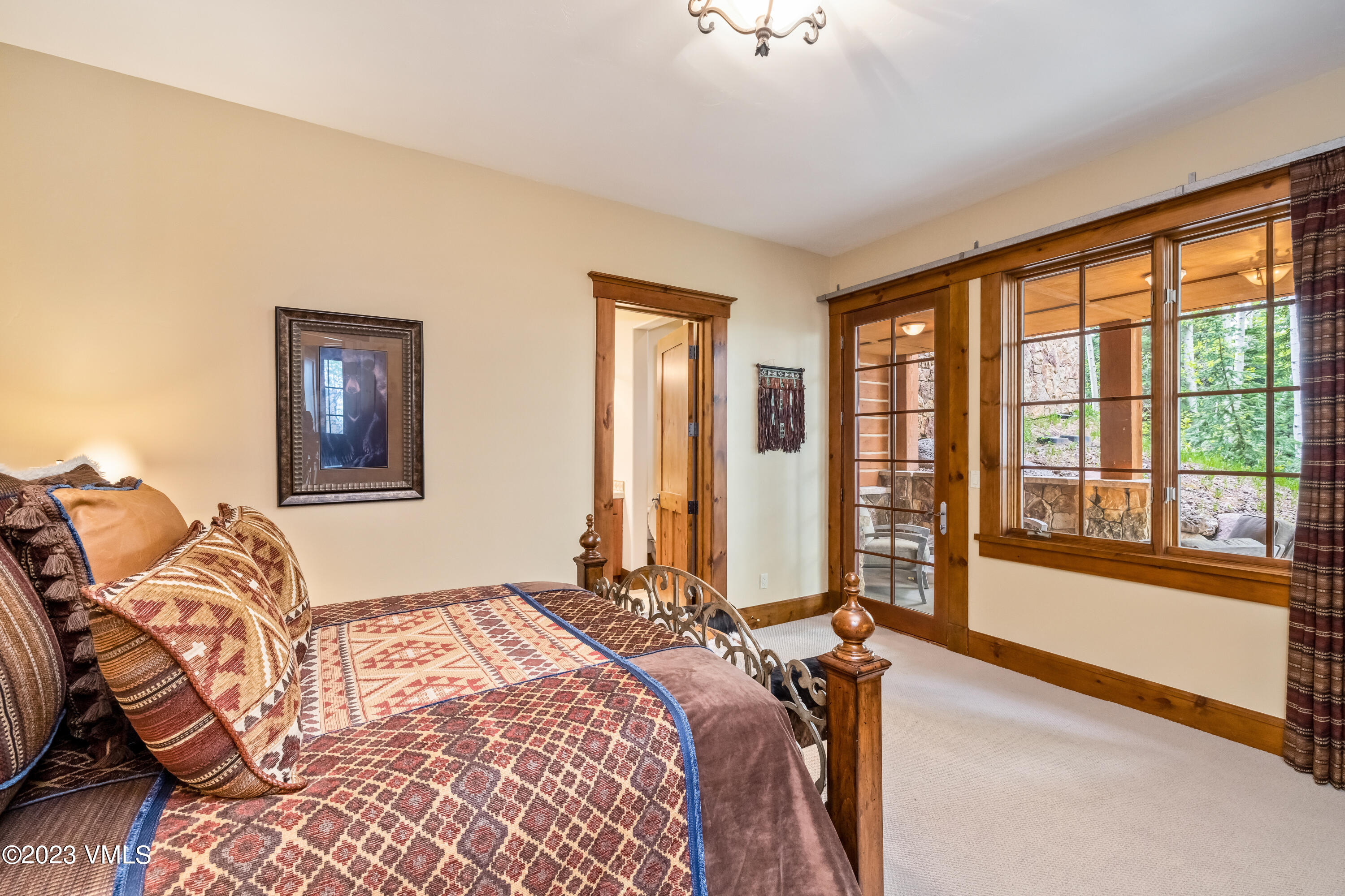 181 Summit Trail Edwards, CO 81632 - Photo 28 of 40 a bedroom with a bed and two large window