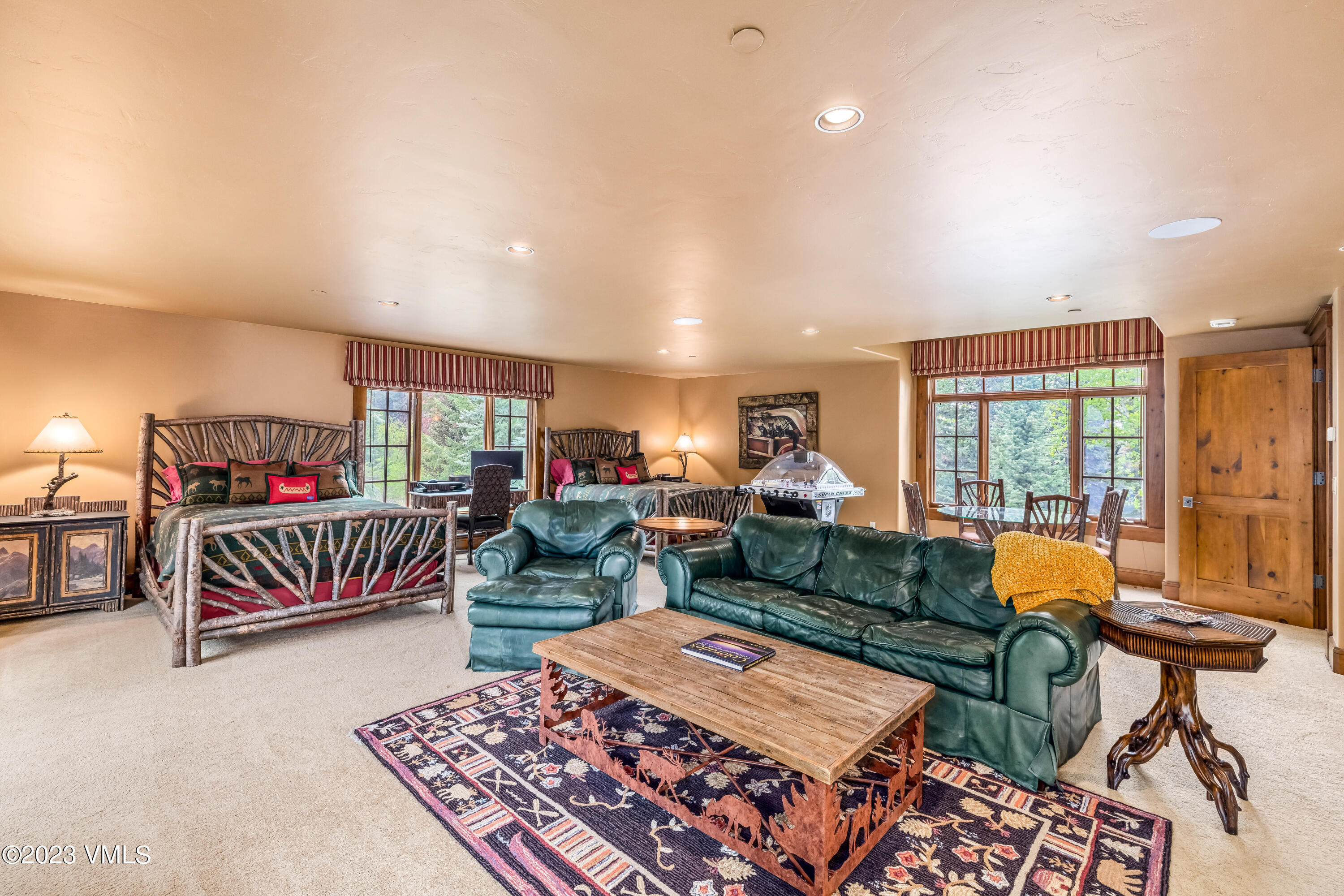 181 Summit Trail Edwards, CO 81632 - Photo 30 of 40 a living room with furniture a rug and a chandelier