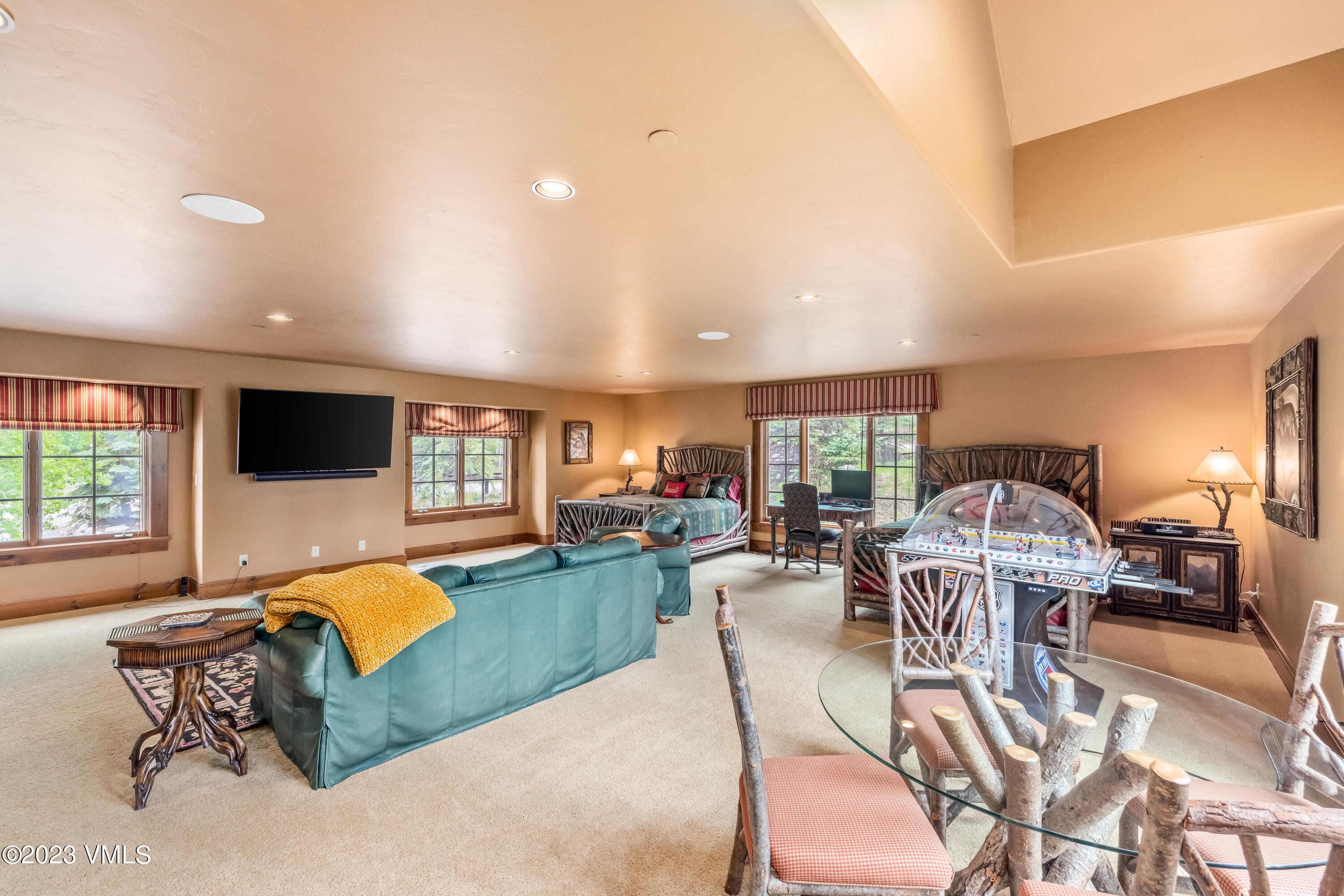 181 Summit Trail Edwards, CO 81632 - Photo 31 of 40 a living room with furniture a flat screen tv and a large window