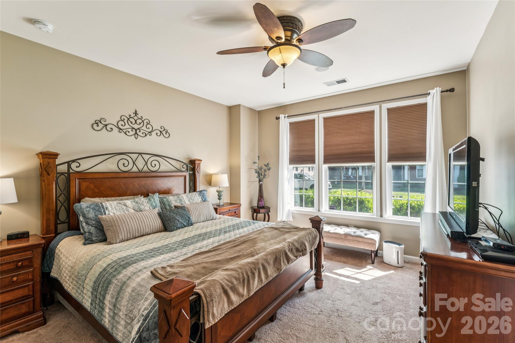 8211 Viewpoint Lane Cornelius, NC 28031 - Photo 12 of 28 a bedroom with a balcony a bed and a large window