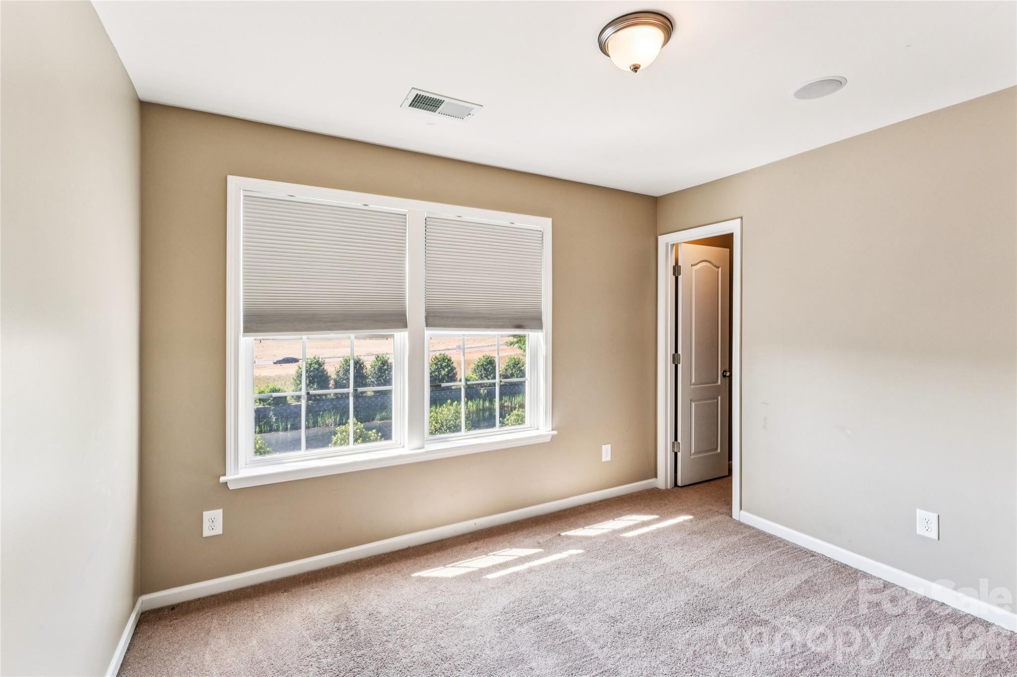 8211 Viewpoint Lane Cornelius, NC 28031 - Photo 17 of 28 an empty room with windows and closet