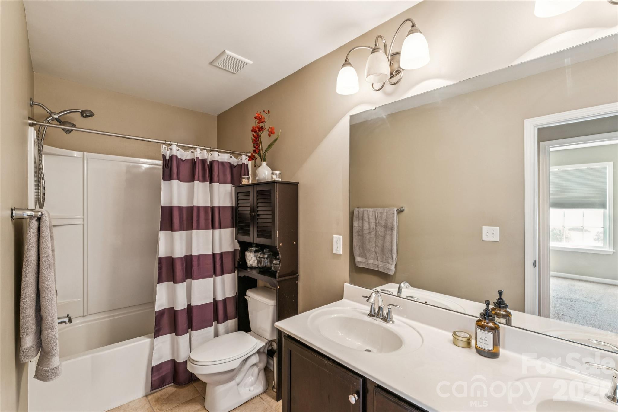8211 Viewpoint Lane Cornelius, NC 28031 - Photo 19 of 28 a bathroom with a sink toilet and shower