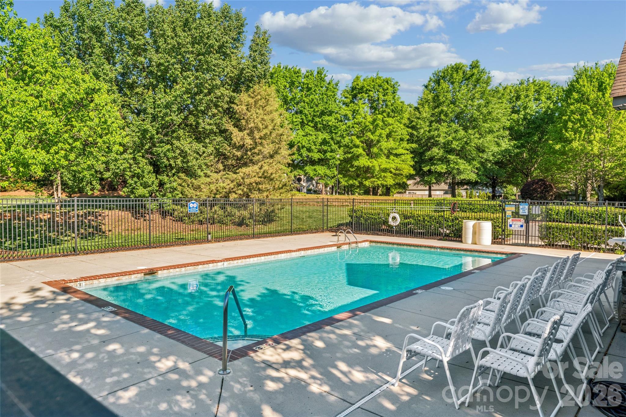 8211 Viewpoint Lane Cornelius, NC 28031 - Photo 27 of 28 a view of a swimming pool with a yard