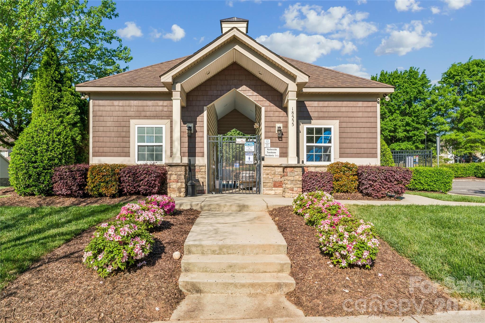 8211 Viewpoint Lane Cornelius, NC 28031 - Photo 28 of 28 a front view of a house with a garden