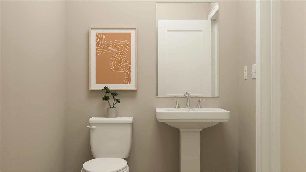 8445 Haaf Road Fogelsville, PA 18051 - Photo 7 of 28 A well-appointed powder room features a classic pedestal sink and toilet, offering both style and utility.