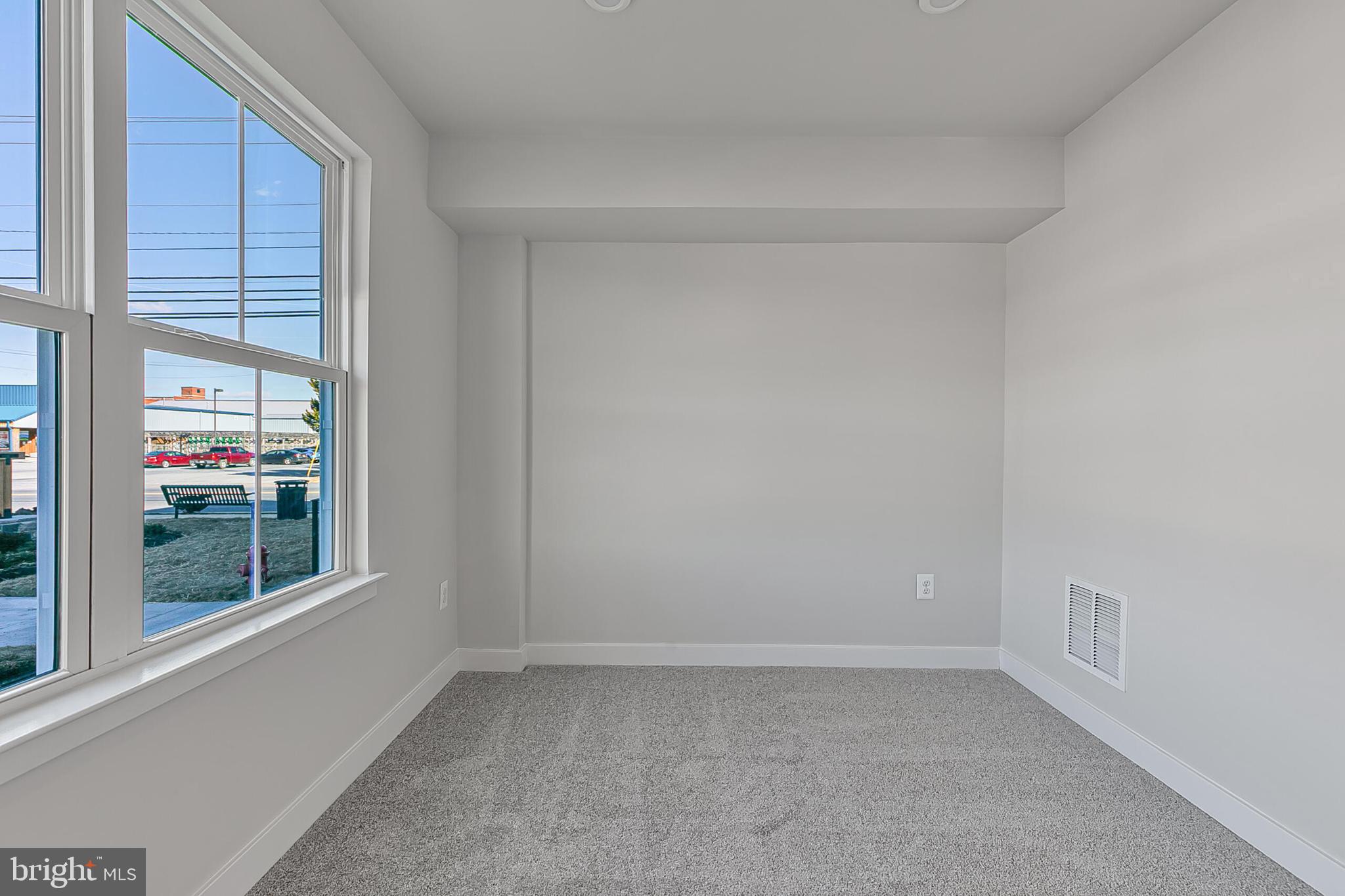 60 C Oasis Avenue Ranson, WV 25438 - Photo 3 of 38 a view of an empty room with a window