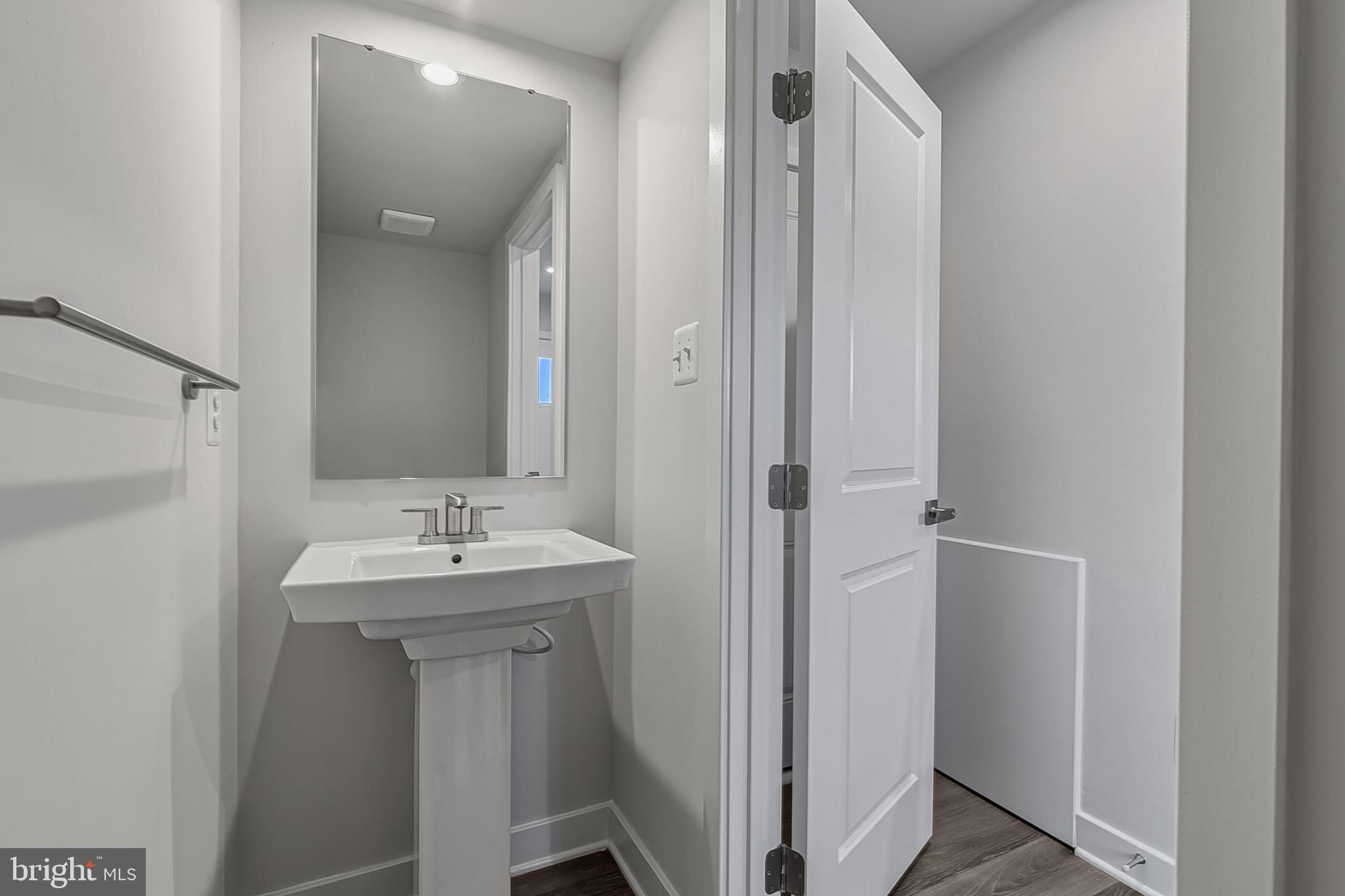 60 C Oasis Avenue Ranson, WV 25438 - Photo 6 of 38 a bathroom with a sink and mirror