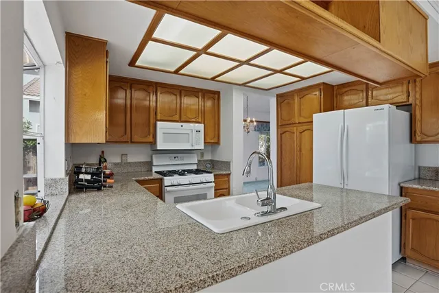 a view of a house with a tree in front