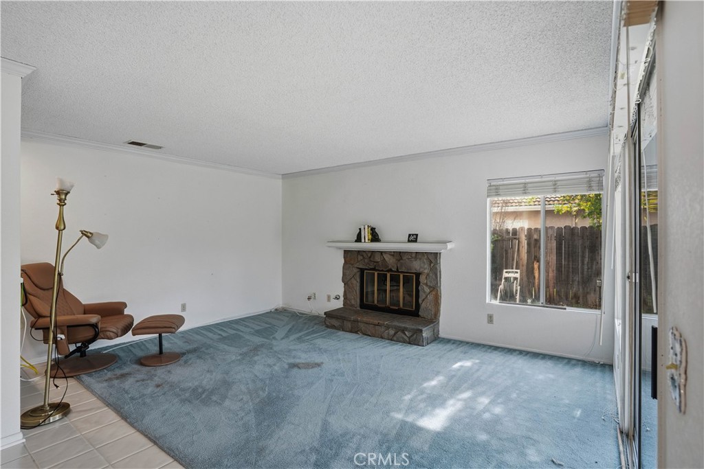25497 Blackwood Road Murrieta, CA 92563 - Photo 17 of 44 a view of a livingroom with a fireplace and workspace