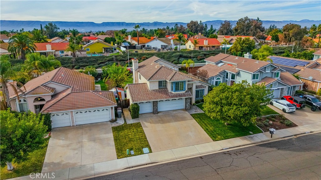 25497 Blackwood Road Murrieta, CA 92563 - Photo 2 of 44 an aerial view of multiple houses with a yard