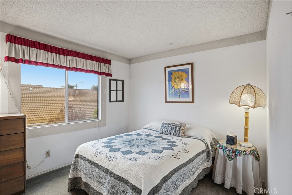 25497 Blackwood Road Murrieta, CA 92563 - Photo 24 of 44 a bedroom with a bed and a table