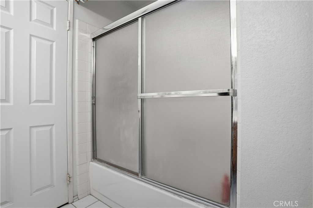 25497 Blackwood Road Murrieta, CA 92563 - Photo 26 of 44 a bathroom with a glass shower door