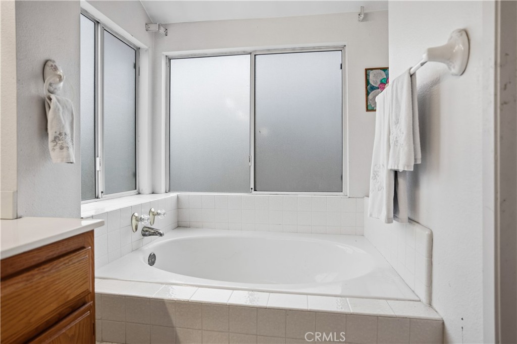 25497 Blackwood Road Murrieta, CA 92563 - Photo 28 of 44 a white bath tub sitting next to a white sink