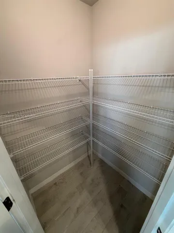 a view of a room with racks on the wall