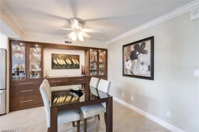 a large kitchen with a table and chairs