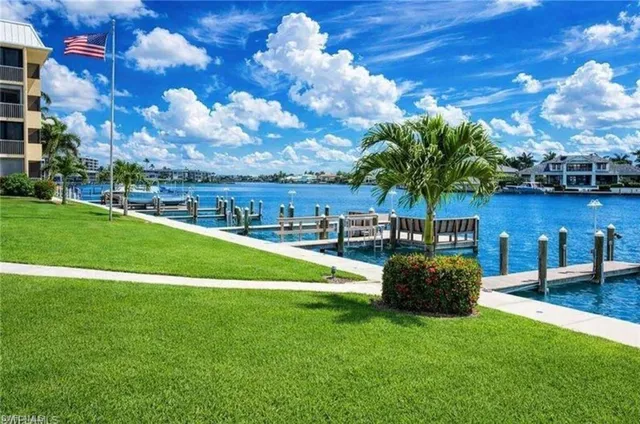 a view of a swimming pool with outdoor seating