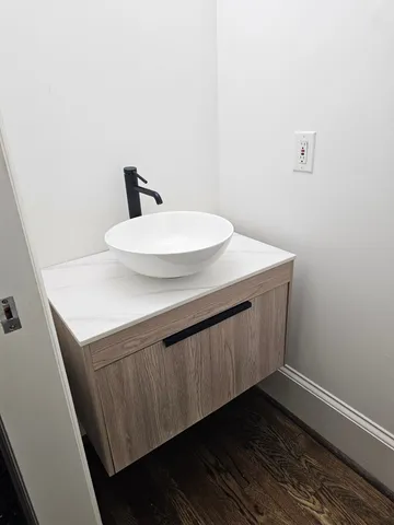 a bathroom with a sink and a mirror