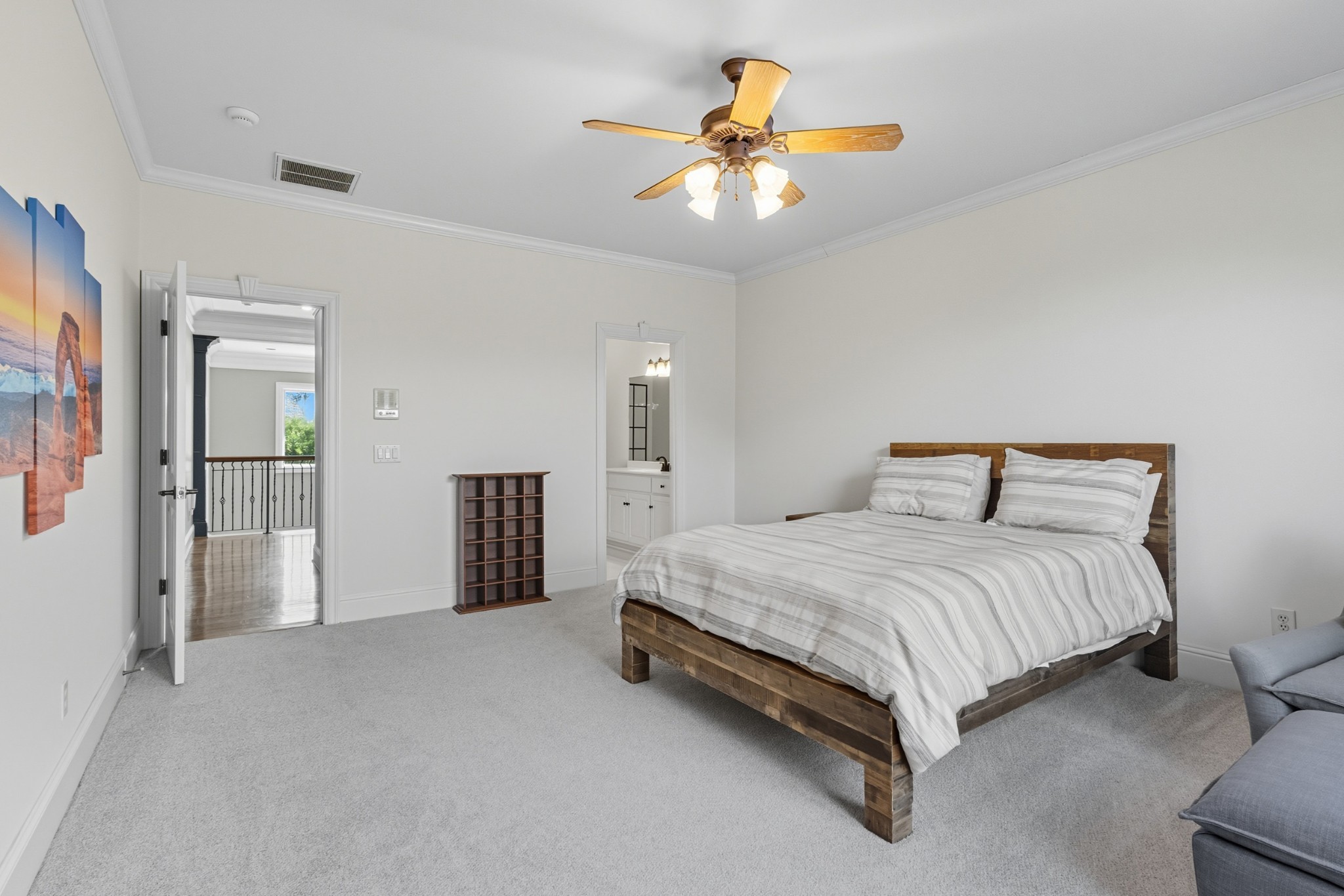 700 Princeton Hills Drive Brentwood, TN 37027 - Photo 21 of 42 a spacious bedroom with a bed and a chandelier