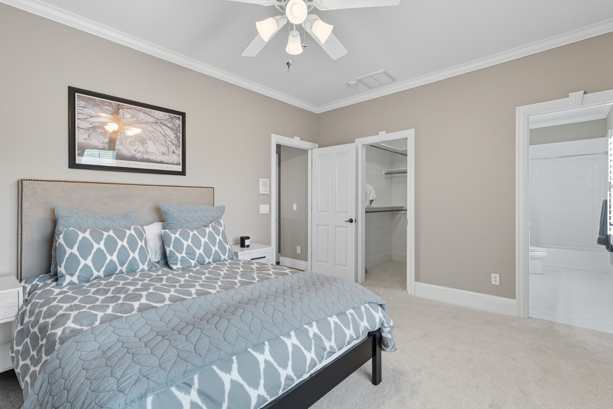 700 Princeton Hills Drive Brentwood, TN 37027 - Photo 27 of 42 a bedroom with a large bed and a chandelier