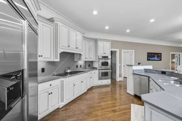 a kitchen with a sink stove and refrigerator