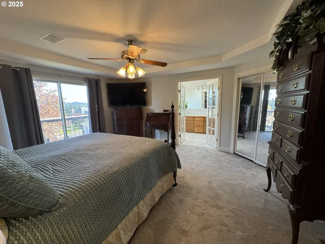 a large kitchen with a sink and large window