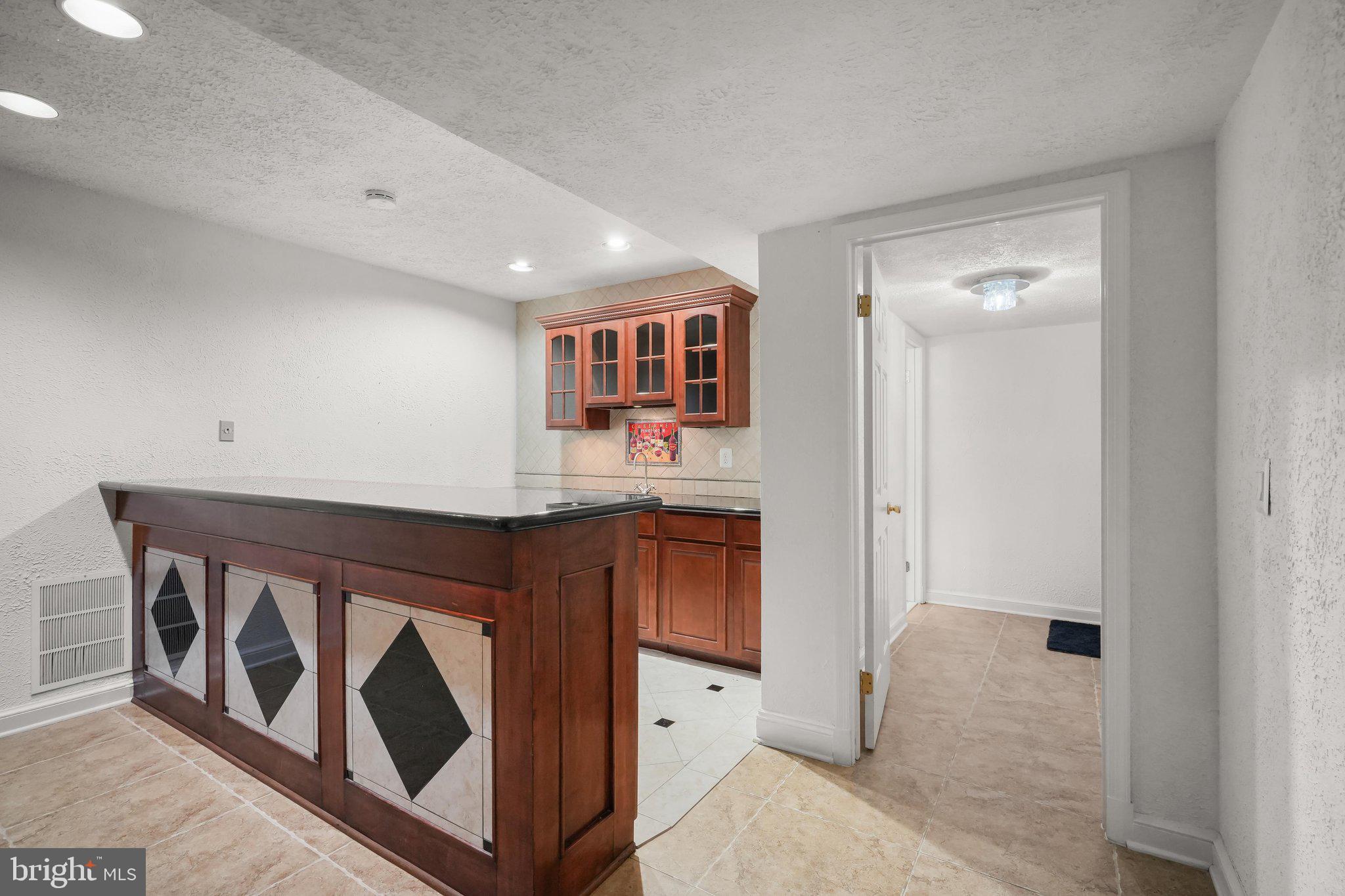 9809 Hall Road Potomac, MD 20854 - Photo 48 of 60 a kitchen with stainless steel appliances granite countertop a stove and a sink